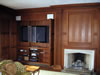 Lee & Sons Woodworkers, Inc. - Trim & Molding: Entertainment center hidden in paneled wall