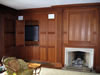 Lee & Sons Woodworkers, Inc. - Trim & Molding: Entertainment center hidden in paneled wall